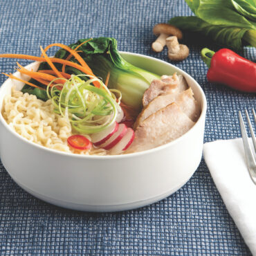 A close-up image of one of the white ceramic soup bowls from the set.